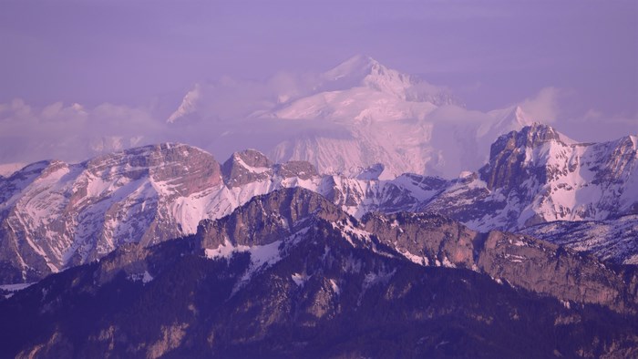 Mont Blanc mountain range under a purple sky