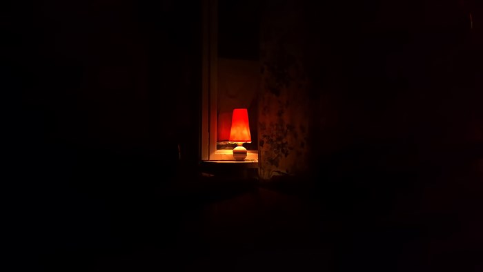 Red lamp in a dark room