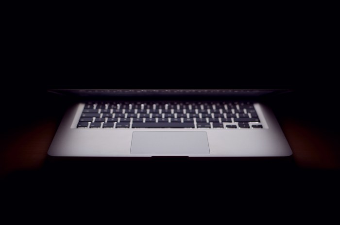 MacBook laptop keyboard in the dark