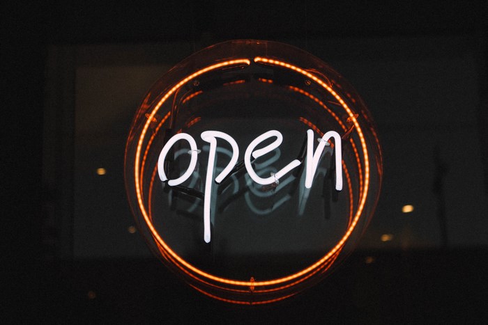 Round neon open sign in Auckland, New Zealand