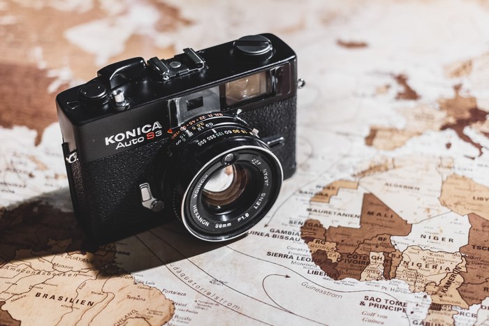 Konica Auto S3 camera on a vintage world map