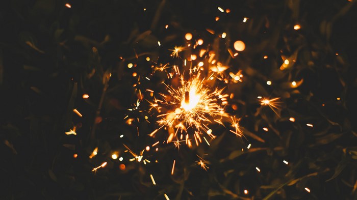 Sparkler with sparks at night