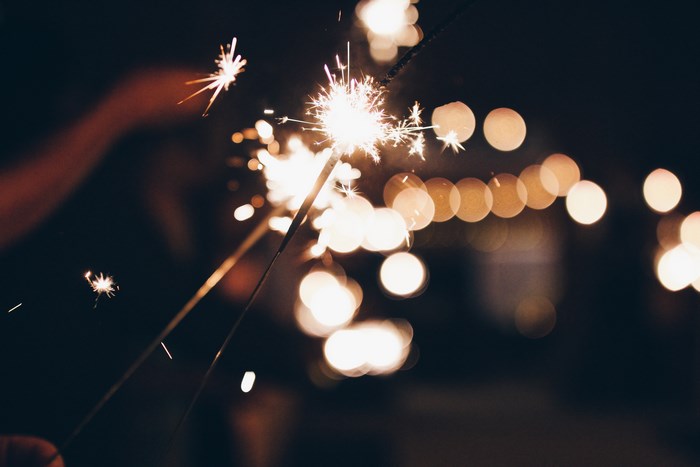 Sparklers and bokeh lights at night