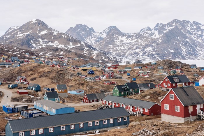 Colorful village nestled in a snowy mountain landscape