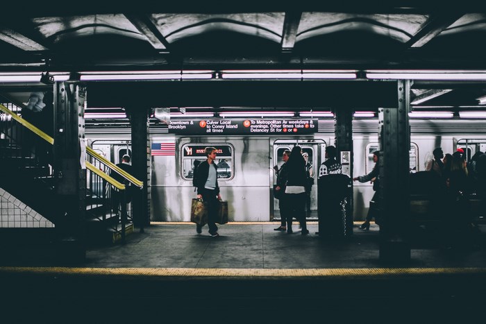 New York City Subway Station with Train and Passengers