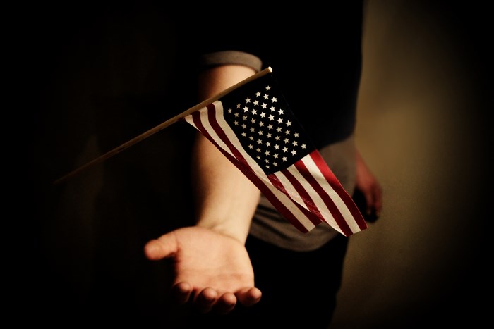 Person holding an American flag