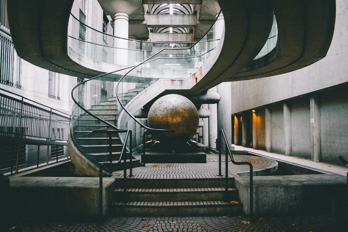 Modern staircase with a large globe sculpture