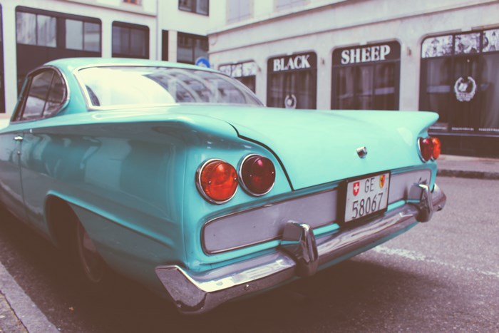 Turquoise vintage car with Swiss license plate