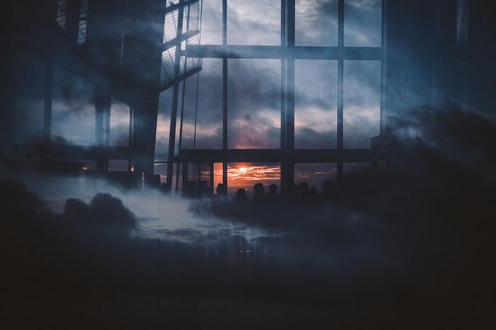 Sunset through windows of The Shard with mist