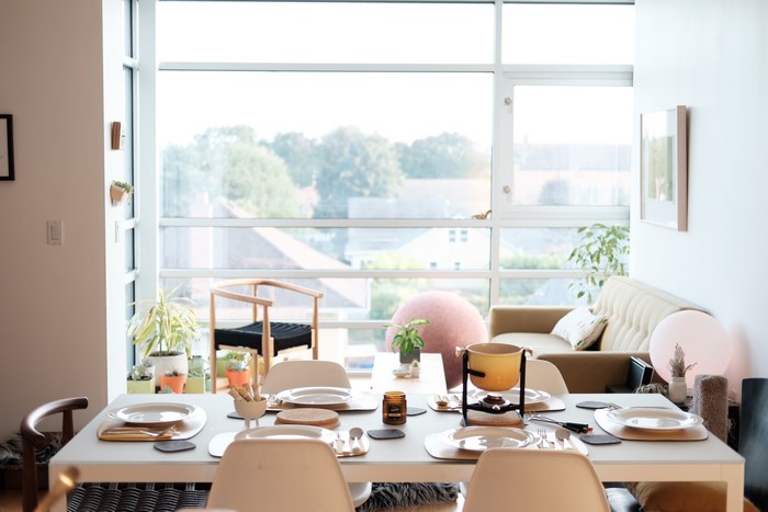 Modern dining room with fondue set and large window