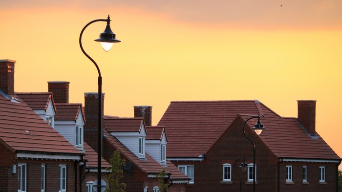 Street lamps and houses at sunset