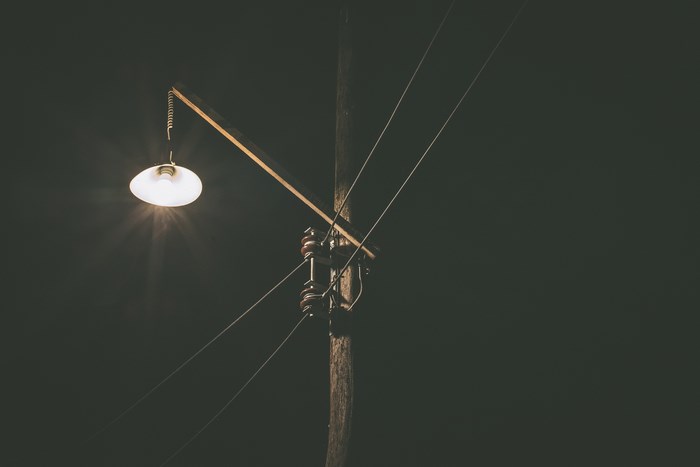 Street lamp and power lines at night