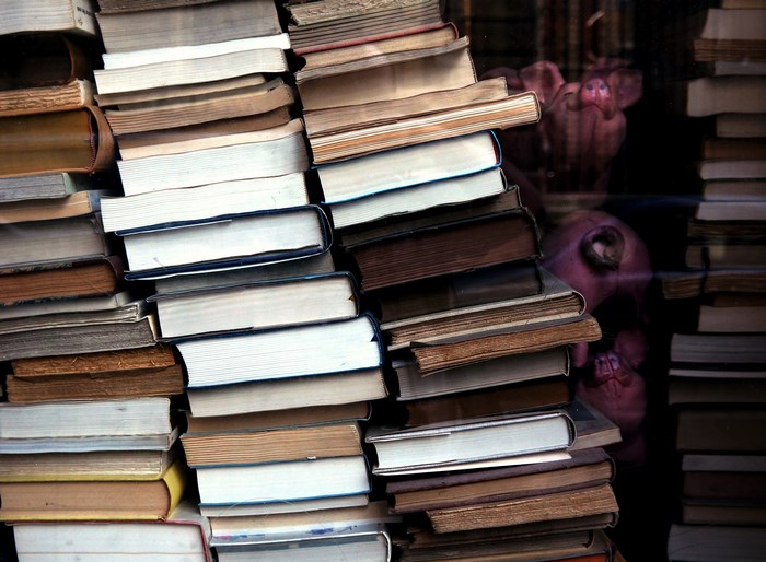 Stack of old books in a shop window