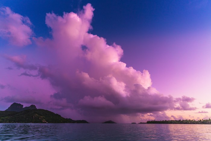 Purple sunset clouds over Bora Bora ocean