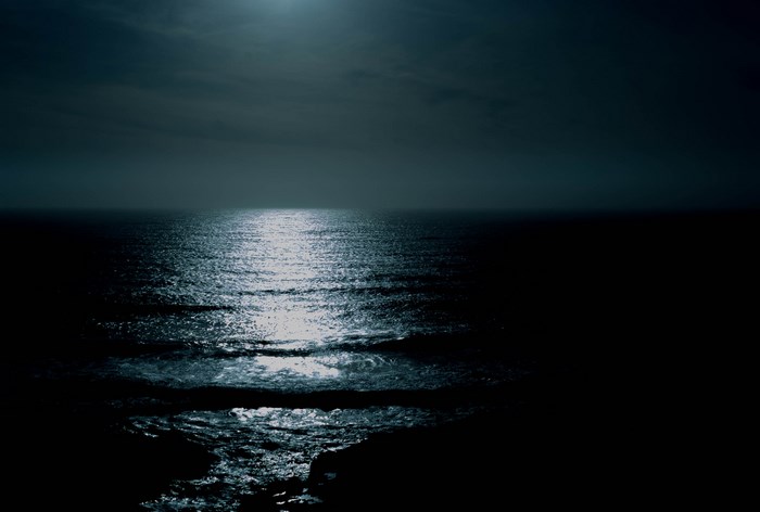 Moonlight reflecting on the ocean at night