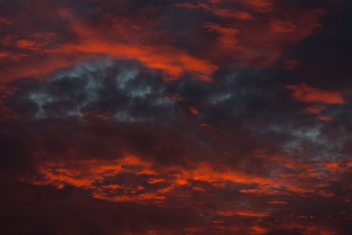 Fiery sunset clouds with a touch of blue