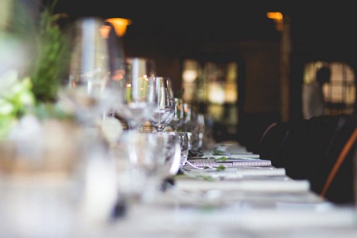 Table setting with wine glasses and napkins