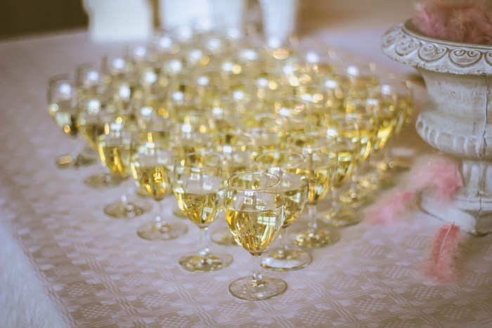 Champagne glasses arranged in a pyramid on a table