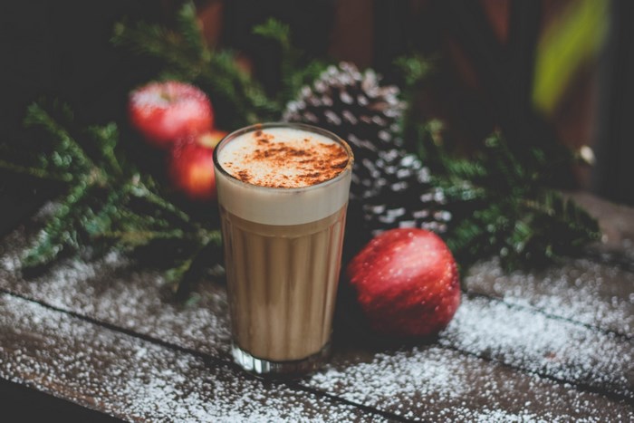 Festive Christmas drink with apples and pinecones