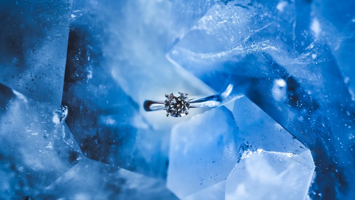 Diamond Wedding Ring on Blue Ice Crystals
