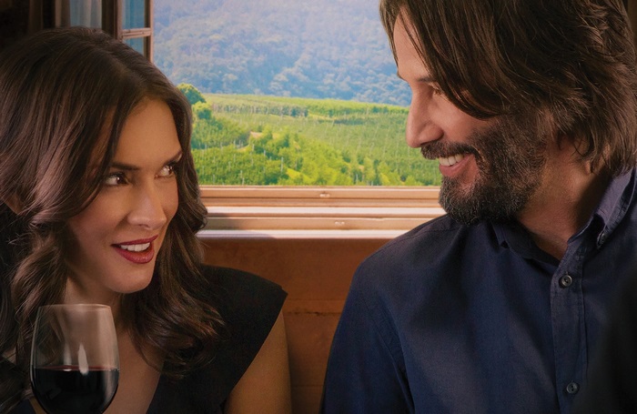 Winona Ryder and Keanu Reeves on a train