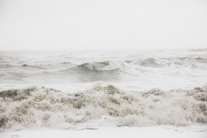 Stormy waves crashing on Reynisfjara beach in Iceland