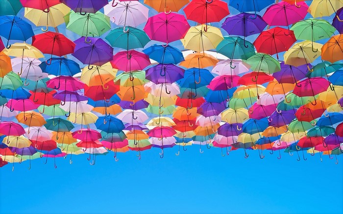A sky filled with colorful umbrellas