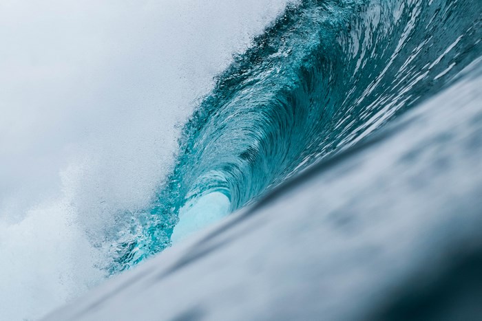 Close-up of a turquoise ocean wave barrel