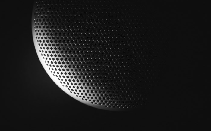 Illuminated perforated surface with geometric pattern