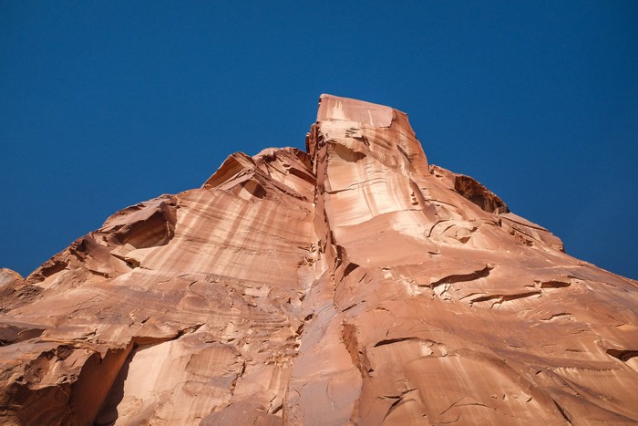 Sandstone rock formation against a blue sky