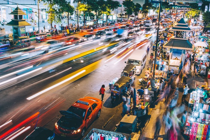 Bangkok street market and traffic at night