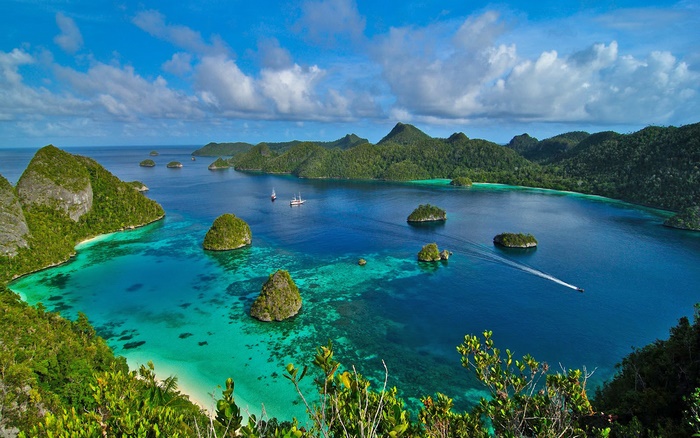 Raja Ampat Islands, Indonesia, with boats and turquoise waters