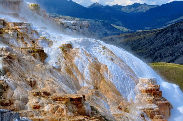 Terraced Hot Springs and Mountain Range in Yellowstone