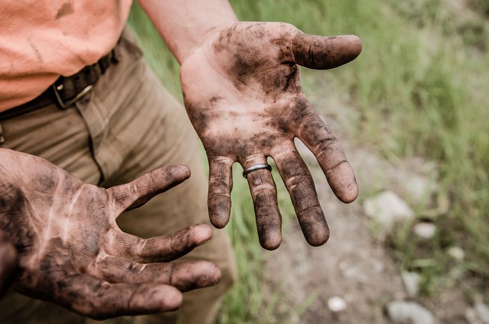 Dirty hands with a wedding ring