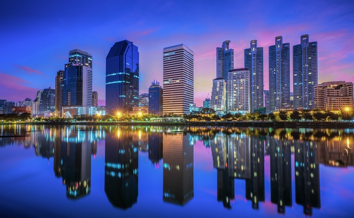 Bangkok skyline with reflections at dusk