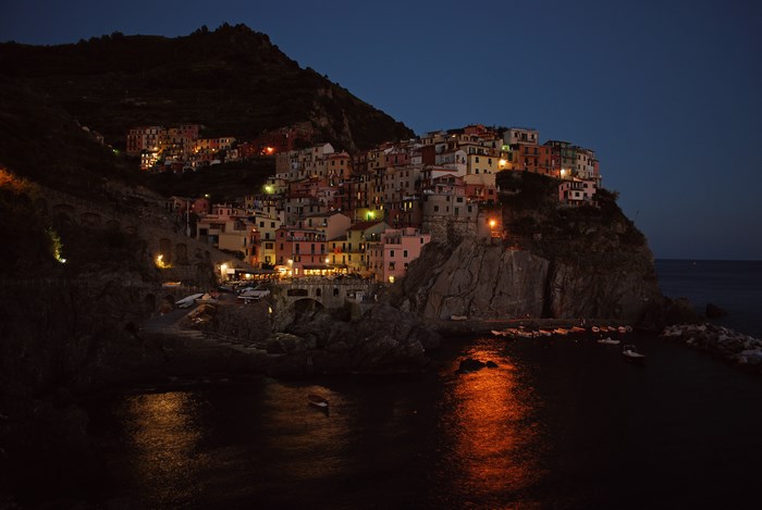 Manarola village on a cliffside at night