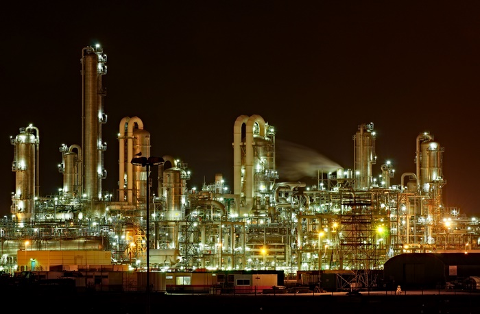 Chemical plant at night with illuminated structures