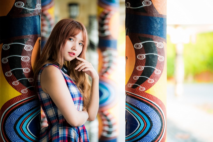 Portrait of a Woman in Colorful Dress with Artistic Background