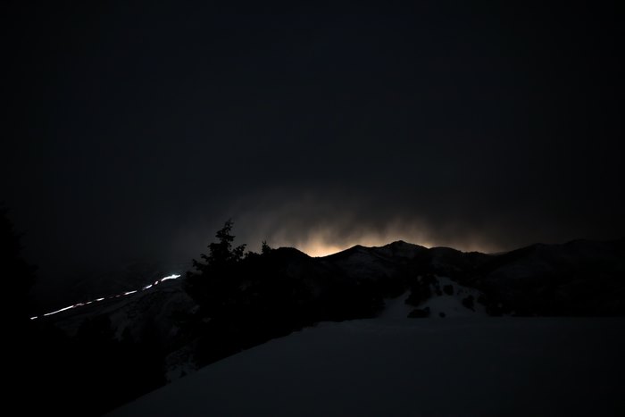 Night photography of a mountain range with lights