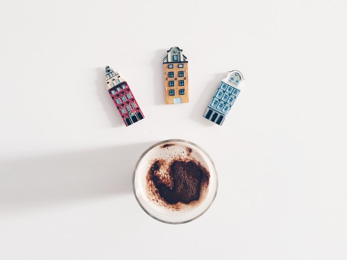 Miniature Amsterdam buildings and a cup of cocoa