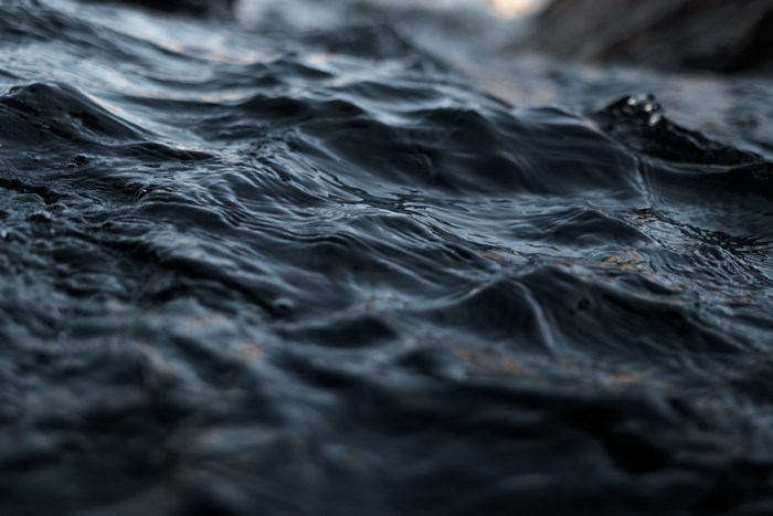 Dark water with ripples and waves
