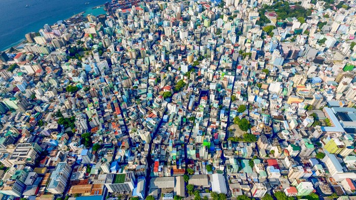 Aerial view of a densely packed city on an island in the Maldives