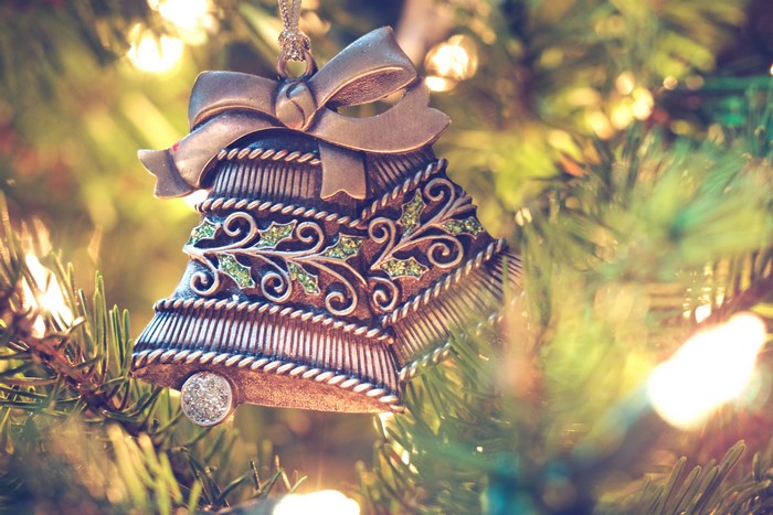 Christmas bell ornament on a tree
