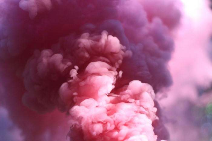 Pink and purple smoke billowing upwards