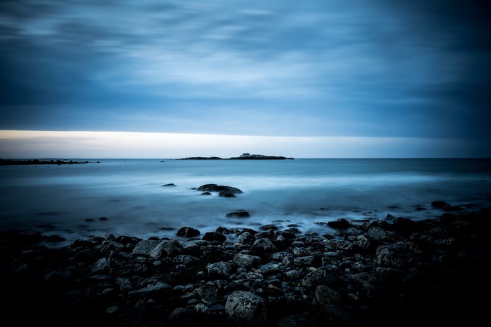 Long exposure of a rocky coast at dusk