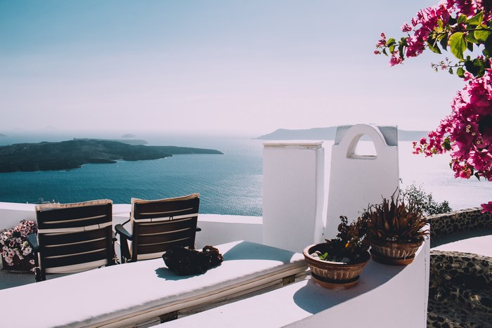Santorini balcony with chairs overlooking the sea