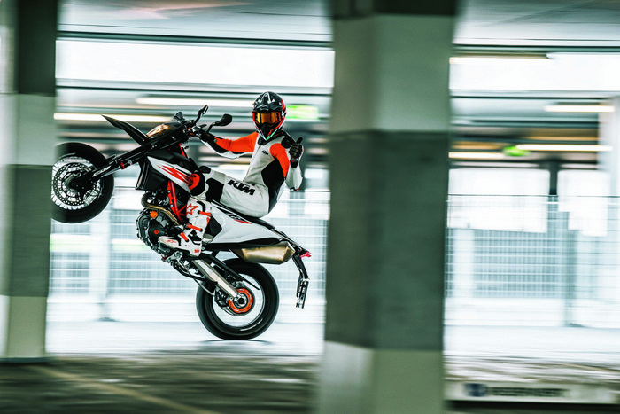 KTM 690 SMC R Supermoto performing a wheelie