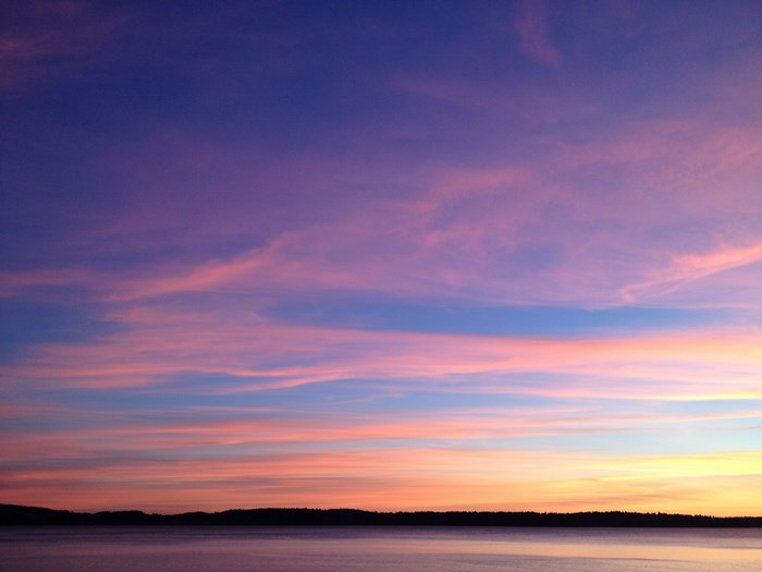 Sunset over a calm lake with colorful clouds