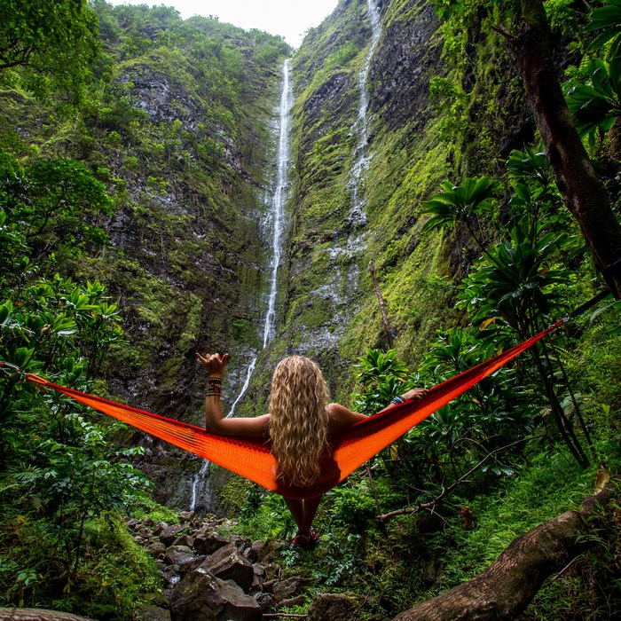 Woman in hammock at Oahu waterfall