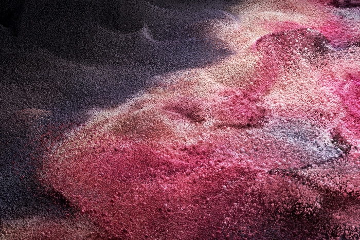 Pink and dark grainy texture